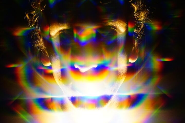 A portrait of a person, using a diffraction filter that splits the images many times in a creepy fashion