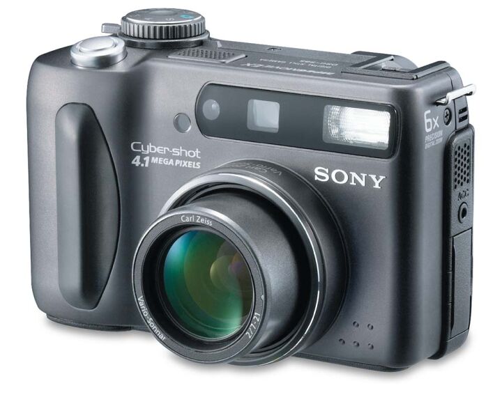 A grey camera with a large lens