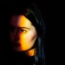 light shining on a person's face